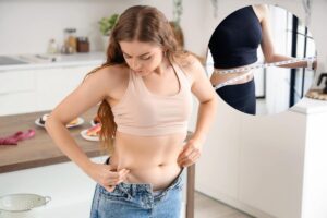persona che tocca la pancia- persona che misura vita