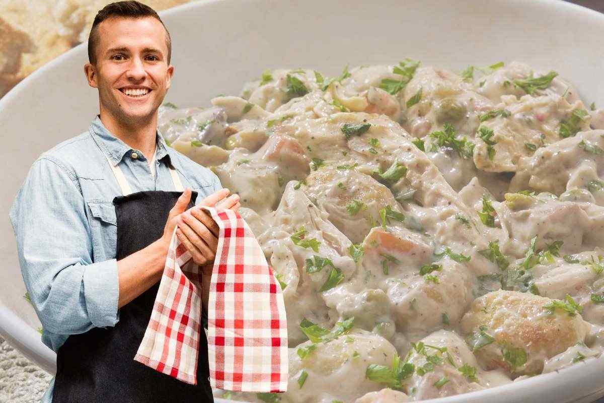 uomo con il grambiule e piatto di gnocchi