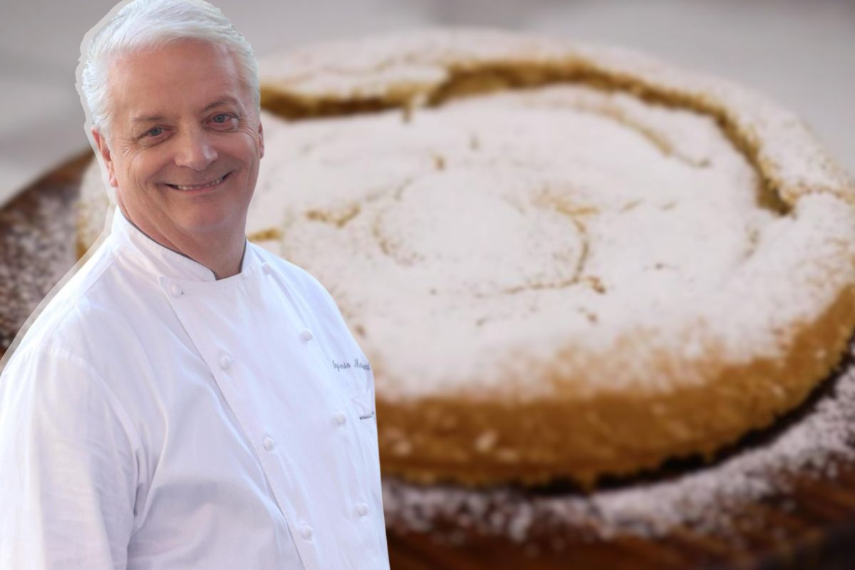 Iginio Massari in primo piano e torta