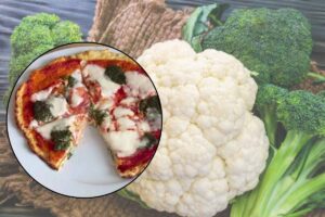 Pizza e verdure nello sfondo