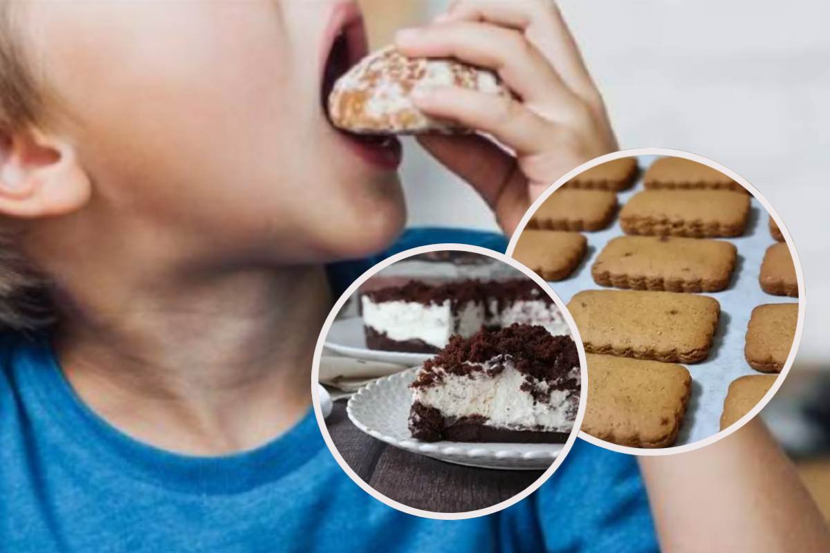 Bimbo che mangia e in evidenza dei biscotti e una sbriciolata